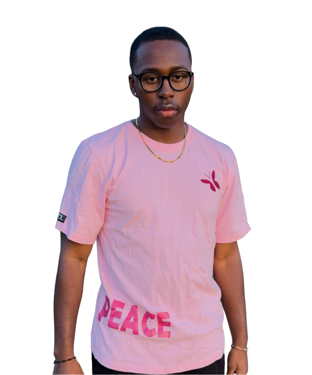 Person wearing a pink t-shirt with 'PEACE' printed on it against a white background
